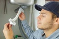 Man fixing pipes under sink Royalty Free Stock Photo