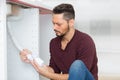 man fixing sink pipe in kitchen Royalty Free Stock Photo