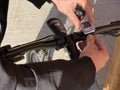 Man fixing watch on bike`s handlebar close-up. Bicycle equipment. Sport. Outdoor activities