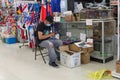 Man Flea Market Customer Wearing a Mask Looks through Boxes of Merchandise, Toy Cars Royalty Free Stock Photo