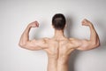 Man flexing biceps and back muscles Royalty Free Stock Photo