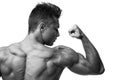 Man Flexing Muscles, Rear View. Royalty Free Stock Photo