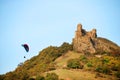 A man flies in his paraglider near Siria Medieval Fortress in Arad County, Romania.