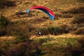 A man flies in his paraglider near Siria Medieval Fortress in Arad County, Romania.
