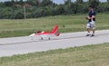 Man flies Model Airplane with controller