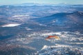 Man flies with an orange parachute Royalty Free Stock Photo