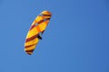A man flies on a paraglider in a clear blue sky close-up Royalty Free Stock Photo