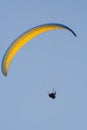 A man flies on paraplane. Clear blue sky Royalty Free Stock Photo