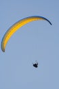 A man flies on paraplane. Clear blue sky