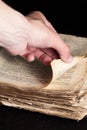 Man flips through an old copy of the Bible Royalty Free Stock Photo