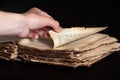 Man flips through an old copy of the Bible Royalty Free Stock Photo