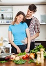 Man flirting with pretty girl in kitchen