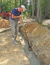 Man floating concrete footer Royalty Free Stock Photo