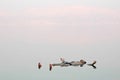 Man floating in a glassy water of dead sea