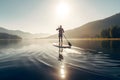 Man floating on lake on SUP, at sunset. Generative AI content.