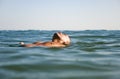 Man floating in water. Royalty Free Stock Photo