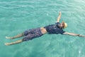 man floating on the water. Summer relaxation Royalty Free Stock Photo