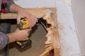 Man floor repair in the house plywood replacement Royalty Free Stock Photo