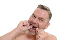 Man flossing his teeth with dental floss Royalty Free Stock Photo