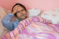 Man with flu into bed Royalty Free Stock Photo
