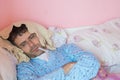 Man with flu into bed Royalty Free Stock Photo