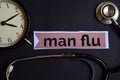 Man Flu on the print paper with Healthcare Concept Inspiration. alarm clock, Black stethoscope. Royalty Free Stock Photo