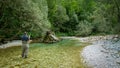 A man fly fishing on the alpine Soca River near Tolmin, Slovenia