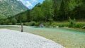 A man fly fishing on the alpine Soca River near Tolmin, Slovenia Royalty Free Stock Photo