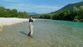 A man fly fishing on the alpine Soca River near Tolmin, Slovenia Royalty Free Stock Photo