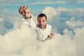 Man flying through the clouds Royalty Free Stock Photo