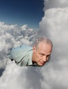A Man Flying Through the Clouds Royalty Free Stock Photo