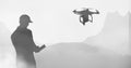 Man flying a drone silhouette in sky Royalty Free Stock Photo