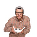 Man with flying drone. Studio shot on white background. Royalty Free Stock Photo