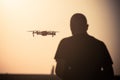 Man flying a drone at sunrise Royalty Free Stock Photo