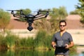 Man Flying a High-Tech Camera Drone Royalty Free Stock Photo