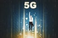 Man flying upwards with 5G network symbol Royalty Free Stock Photo