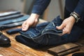 Man folding jeans concep clothing