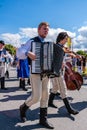 A man in folk costume plays the accordion in the procession Royalty Free Stock Photo