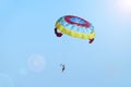 Man is fond of parasailing along sky. Free flying with parachute Royalty Free Stock Photo