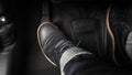 Man foot and accelerator and brake pedal inside the car Royalty Free Stock Photo