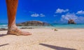 Man foot on a beautiful beach. Tropical resort abstract Royalty Free Stock Photo