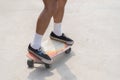 Man foot playing skateboard sweeping turns on surf skate on street road, control motion balancing movement extreme outdoor Royalty Free Stock Photo