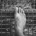 A man foot on the stairs, abstract black and white image