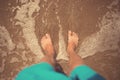 Man foots at seashore