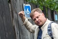 The man forcefully punches the closed wooden door Royalty Free Stock Photo