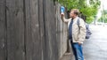 Man forcefully punches the closed wooden door Royalty Free Stock Photo