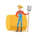 Man With Fork Standing Next To Hay Stack, Farmer Working At The Farm And Selling On Natural Organic Product Market