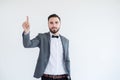 Man in formal suit with hands pointing and touching virtual screen on white background,Copy space for text Royalty Free Stock Photo