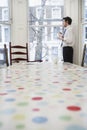 Man In Formals At Window In Dining Room