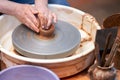 A man forms a ceramic product: a potter`s wheel, hands, raw clay. Selective focus Royalty Free Stock Photo